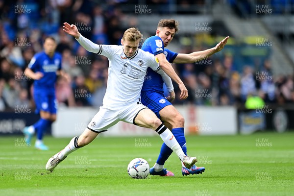 020422 - Cardiff City v Swansea City - Sky Bet Championship - Flynn Downes of Swansea City vies for possession with Ryan Wintle of Cardiff City 
