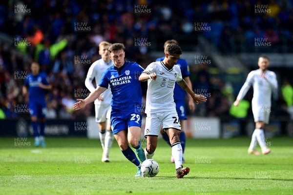 020422 - Cardiff City v Swansea City - Sky Bet Championship - Mark Harris of Cardiff City vies for possession with Kyle Naughton of Swansea City 