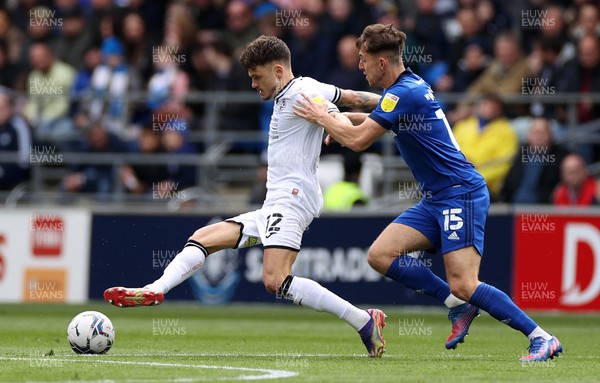 020422 - Cardiff City v Swansea City, South Wales derby - SkyBet Championship - Jamie Paterson of Swansea City is challenged by Ryan Wintle of Cardiff City