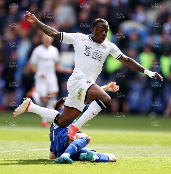 020422 - Cardiff City v Swansea City, South Wales derby - SkyBet Championship - Michael Obafemi of Swansea City is tackled by Perry Ng of Cardiff City