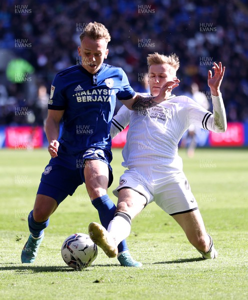 020422 - Cardiff City v Swansea City, South Wales derby - SkyBet Championship - Isaak Davies of Cardiff City is tackled by Flynn Downes of Swansea City
