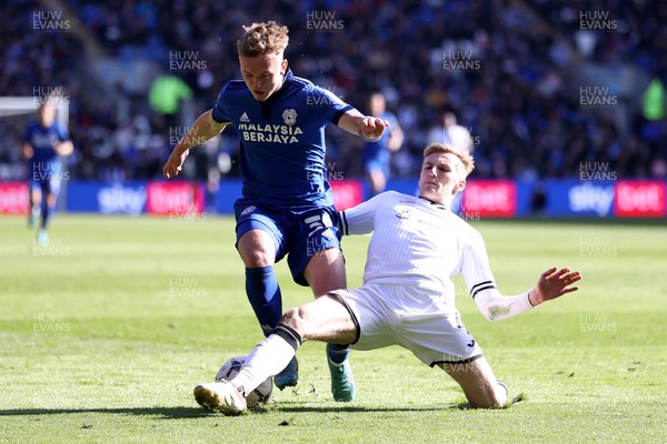 020422 - Cardiff City v Swansea City, South Wales derby - SkyBet Championship - Isaak Davies of Cardiff City is tackled by Flynn Downes of Swansea City