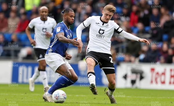 120120 - Cardiff City v Swansea City - SkyBet Championship - Leandro Bacuna of Cardiff City is tackled by George Byers of Swansea City