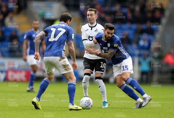 120120 - Cardiff City v Swansea City - SkyBet Championship - Marlon Pack of Cardiff City is tackled by Bersant Celina of Swansea City