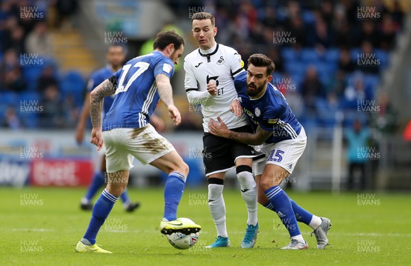 120120 - Cardiff City v Swansea City - SkyBet Championship - Marlon Pack of Cardiff City is tackled by Bersant Celina of Swansea City