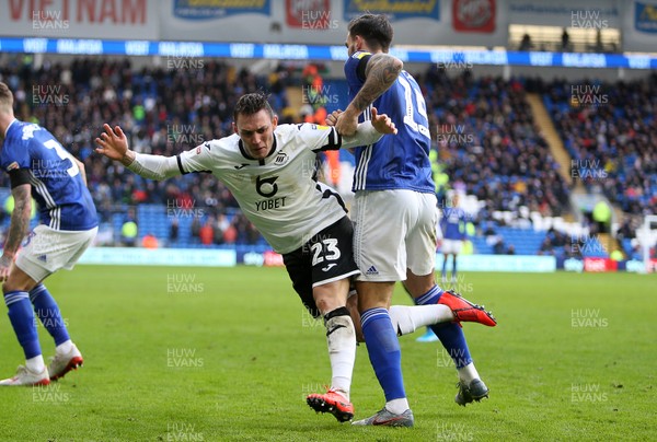 120120 - Cardiff City v Swansea City - SkyBet Championship - Connor Roberts of Swansea City is taken down by Marlon Pack of Cardiff City