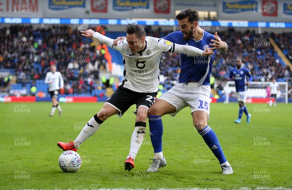 120120 - Cardiff City v Swansea City - SkyBet Championship - Connor Roberts of Swansea City is taken down by Marlon Pack of Cardiff City