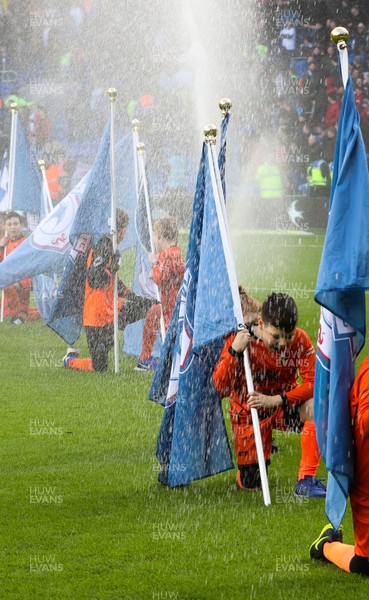 120120 - Cardiff City v Swansea City, Sky Bet Championship - The flag bearers get soaked by the water sprinklers at the start of the match