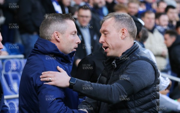 120120 - Cardiff City v Swansea City, Sky Bet Championship - Cardiff City manager Neil Harris, left, and Swansea City head coach Steve Cooper at the start of the match