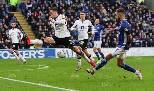 120120 - Cardiff City v Swansea City, Sky Bet Championship - Connor Roberts of Swansea City stretches to stop a shot from Joe Bennett of Cardiff City