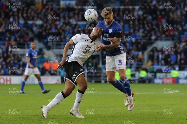 120120 - Cardiff City v Swansea City, Sky Bet Championship - Andre Ayew of Swansea City and Joe Bennett of Cardiff City compete for the ball