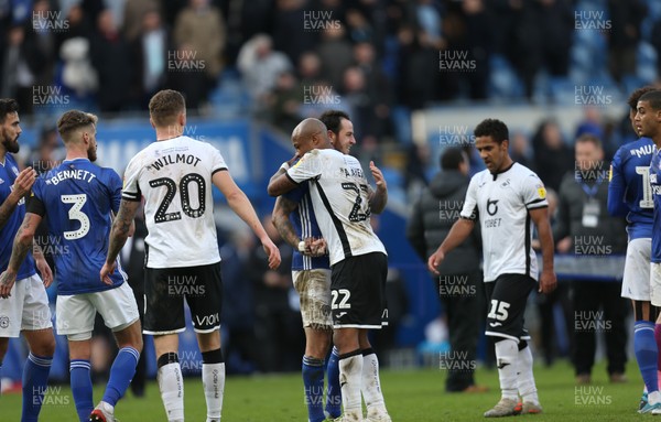 120120 - Cardiff City v Swansea City, Sky Bet Championship - Andre Ayew of Swansea City and Lee Tomlin of Cardiff City embrace at the end of the match