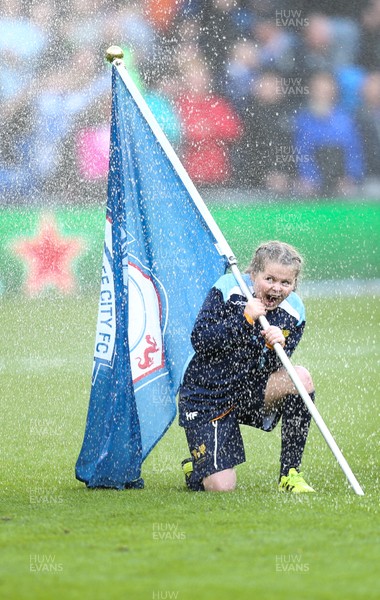 120120 - Cardiff City v Swansea City, Sky Bet Championship - Flag bearers get soaked by the ground's sprinkler system before the start of the match