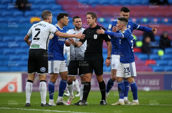 121220 - Cardiff City v Swansea City - SkyBet Championship - Referee John Brooks is surrounded by players