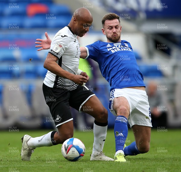 121220 - Cardiff City v Swansea City - SkyBet Championship - Andre Ayew of Swansea City is tackled by Joe Ralls of Cardiff City