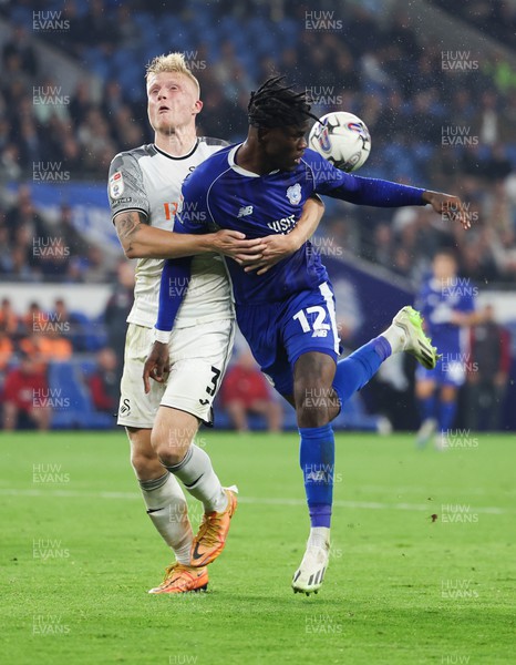 160923 - Cardiff City v Swansea City, EFL Sky Bet Championship - Ike Ugbo of Cardiff City and Kristian Pedersen of Swansea City compete for the ball