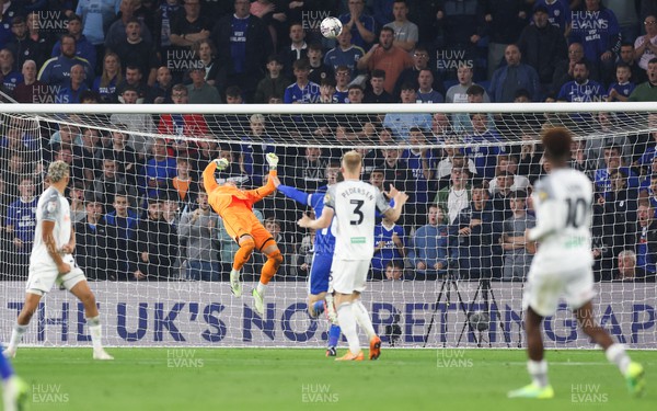 160923 - Cardiff City v Swansea City, EFL Sky Bet Championship - Swansea City goalkeeper Carl Rushworth tips a shot from Yakou Meite of Cardiff City over the bar