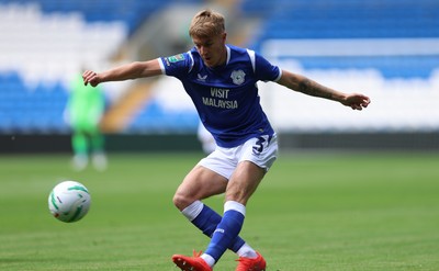080826 - Cardiff City v Swindon Town, EFL Carabao Cup - Joel Bagan of Cardiff City crosses the ball