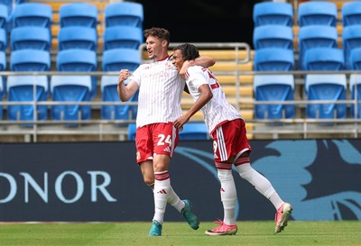 080826 - Cardiff City v Swindon Town, EFL Carabao Cup - Louis Millward of Swindon Town celebrates with Matty Virtue of Swindon Town after scoring the opening goal
