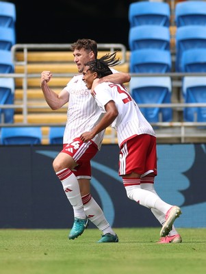 080826 - Cardiff City v Swindon Town, EFL Carabao Cup - Louis Millward of Swindon Town celebrates with Matty Virtue of Swindon Town after scoring the opening goal
