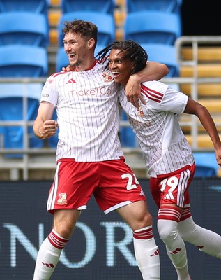 080826 - Cardiff City v Swindon Town, EFL Carabao Cup - Louis Millward of Swindon Town celebrates with Matty Virtue of Swindon Town after scoring the opening goal