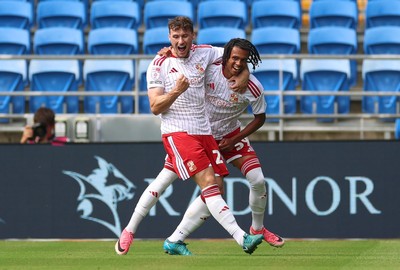 080826 - Cardiff City v Swindon Town, EFL Carabao Cup - Louis Millward of Swindon Town celebrates with Matty Virtue of Swindon Town after scoring the opening goal
