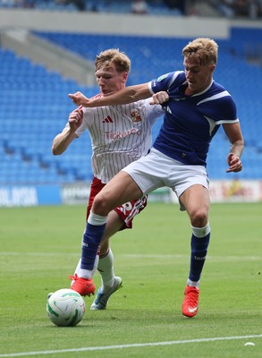 080826 - Cardiff City v Swindon Town, EFL Carabao Cup - Joel Bagan of Cardiff City holds off Sam Inwood of Swindon Town