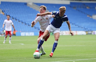 080826 - Cardiff City v Swindon Town, EFL Carabao Cup - Joel Bagan of Cardiff City holds off Sam Inwood of Swindon Town