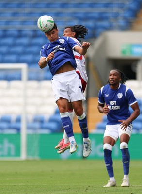 080826 - Cardiff City v Swindon Town, EFL Carabao Cup - Alex Robertson of Cardiff City heads the ball forward
