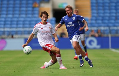080826 - Cardiff City v Swindon Town, EFL Carabao Cup - Isaak Davies of Cardiff City plays the ball forward