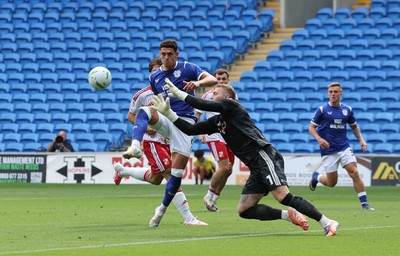 080826 - Cardiff City v Swindon Town, EFL Carabao Cup - Yousef Salech of Cardiff City is denied by Swindon Town goalkeeper Connor Ripley