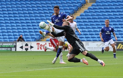 080826 - Cardiff City v Swindon Town, EFL Carabao Cup - Yousef Salech of Cardiff City is denied by Swindon Town goalkeeper Connor Ripley
