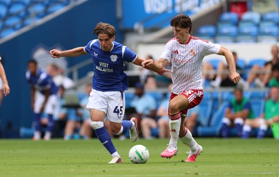 080826 - Cardiff City v Swindon Town, EFL Carabao Cup - Cian Ashford of Cardiff City takes on Stephan Negru of Swindon Town
