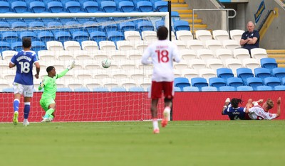 080826 - Cardiff City v Swindon Town, EFL Carabao Cup - Paul Glatzel of Swindon Town, right of frame, beats Cardiff City goalkeeper Nathan Trott to score the second goal