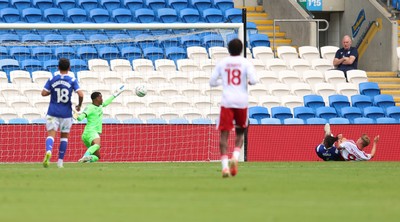 080826 - Cardiff City v Swindon Town, EFL Carabao Cup - Paul Glatzel of Swindon Town, right of frame, beats Cardiff City goalkeeper Nathan Trott to score the second goal