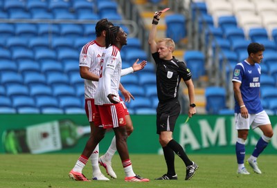 080826 - Cardiff City v Swindon Town, EFL Carabao Cup - James Debayo of Swindon Town is shown a red card by referee Gavin Ward