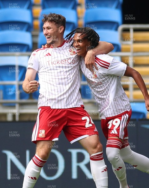 080826 - Cardiff City v Swindon Town, EFL Carabao Cup - Louis Millward of Swindon Town celebrates with Matty Virtue of Swindon Town after scoring the opening goal