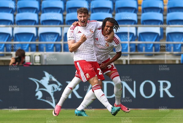 080826 - Cardiff City v Swindon Town, EFL Carabao Cup - Louis Millward of Swindon Town celebrates with Matty Virtue of Swindon Town after scoring the opening goal