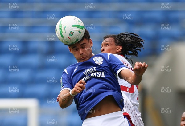 080826 - Cardiff City v Swindon Town, EFL Carabao Cup - Alex Robertson of Cardiff City heads the ball forward