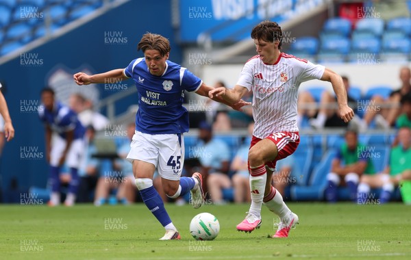 080826 - Cardiff City v Swindon Town, EFL Carabao Cup - Cian Ashford of Cardiff City takes on Stephan Negru of Swindon Town