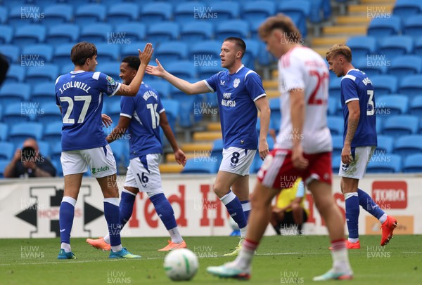 080826 - Cardiff City v Swindon Town, EFL Carabao Cup - Jack Moylan of Cardiff City celebrates with Joel Colwill of Cardiff City after scoring the third goal