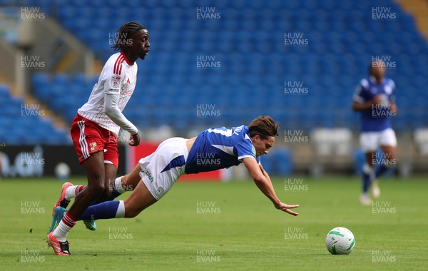 080826 - Cardiff City v Swindon Town, EFL Carabao Cup - Joel Colwill of Cardiff City is brought down by James Debayo of Swindon Town