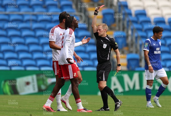080826 - Cardiff City v Swindon Town, EFL Carabao Cup - James Debayo of Swindon Town is shown a red card by referee Gavin Ward
