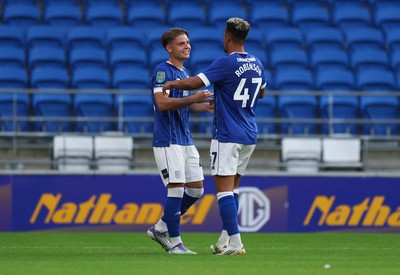 120825 - Cardiff City v Swindon Town, EFL Carabao Cup, Round 1 - Cian Ashford of Cardiff City celebrates with Callum Robinson of Cardiff City after scoring the opening goal