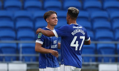 120825 - Cardiff City v Swindon Town, EFL Carabao Cup, Round 1 - Cian Ashford of Cardiff City celebrates with Callum Robinson of Cardiff City after scoring the opening goal