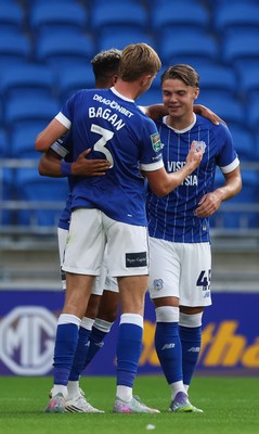 120825 - Cardiff City v Swindon Town, EFL Carabao Cup, Round 1 - Cian Ashford of Cardiff City celebrates with Callum Robinson and Joel Bagan of Cardiff City after scoring the opening goal