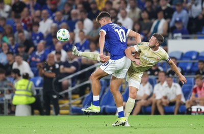 120825 - Cardiff City v Swindon Town, EFL Carabao Cup, Round 1 - Rubin Colwill of Cardiff City is challenged by Ollie Clarke of Swindon Town