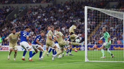 120825 - Cardiff City v Swindon Town, EFL Carabao Cup, Round 1 - James Ball of Swindon Town clears the ball off the line to deny Calum Chambers of Cardiff City a goal