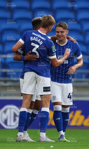 120825 - Cardiff City v Swindon Town, EFL Carabao Cup, Round 1 - Cian Ashford of Cardiff City celebrates with Callum Robinson and Joel Bagan of Cardiff City after scoring the opening goal
