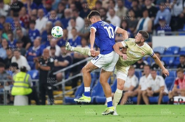 120825 - Cardiff City v Swindon Town, EFL Carabao Cup, Round 1 - Rubin Colwill of Cardiff City is challenged by Ollie Clarke of Swindon Town